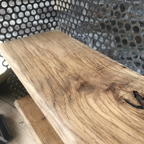 Small reclaimed shelves with perforated mesh design detail