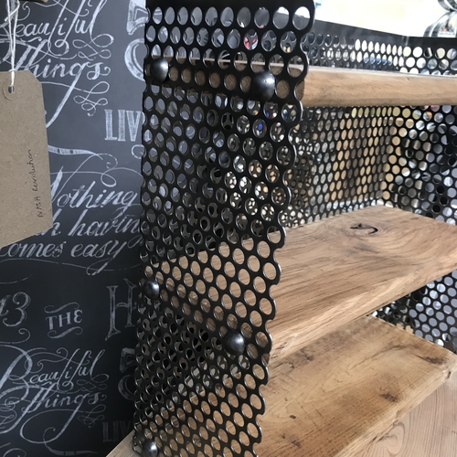 Small reclaimed shelves with perforated mesh design detail