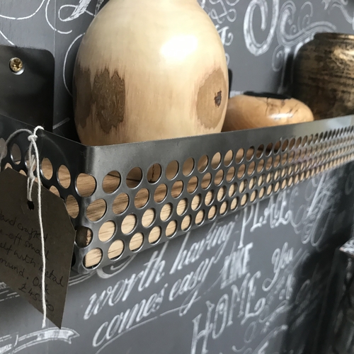 Small shelf with perforated mesh detail surround