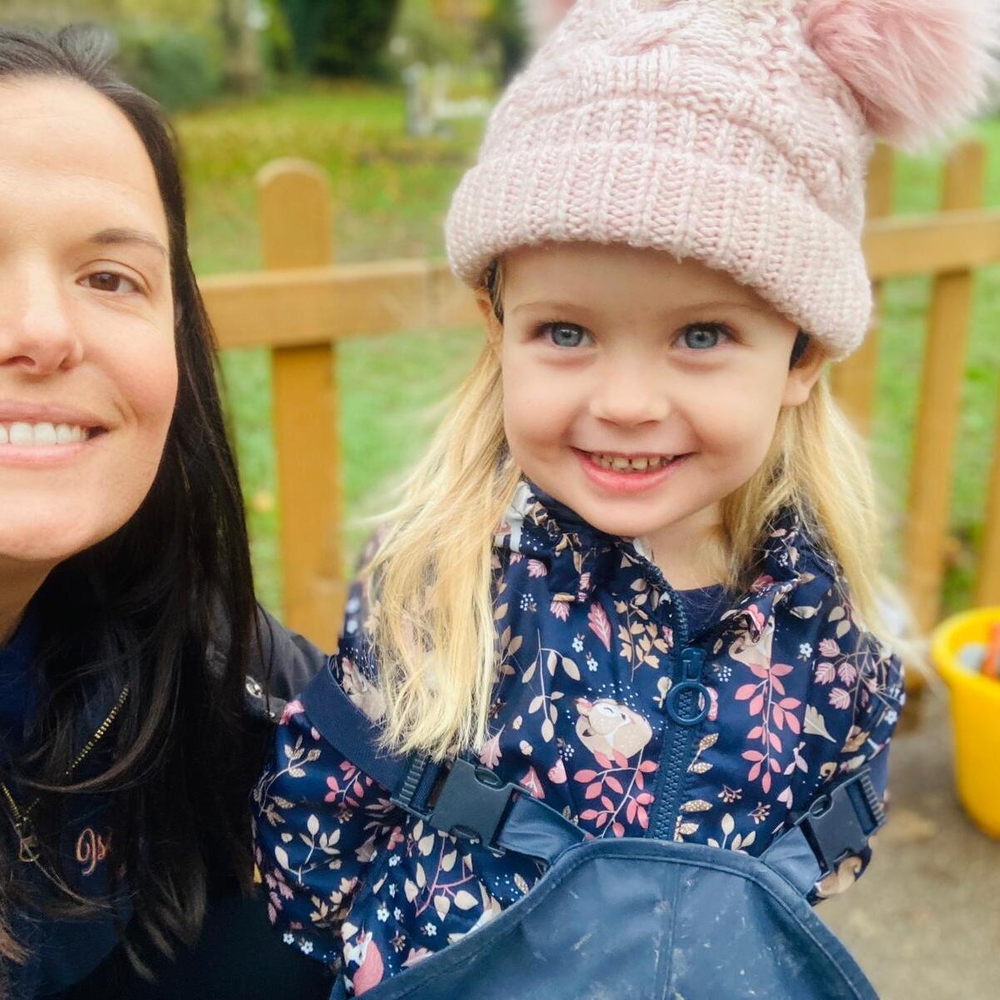 Happy preschool staff and child in setting near Hurstpierpoint