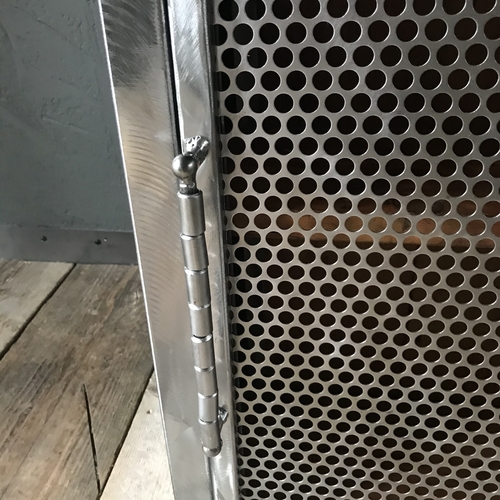 Small industrial cupboard with perforated mesh door