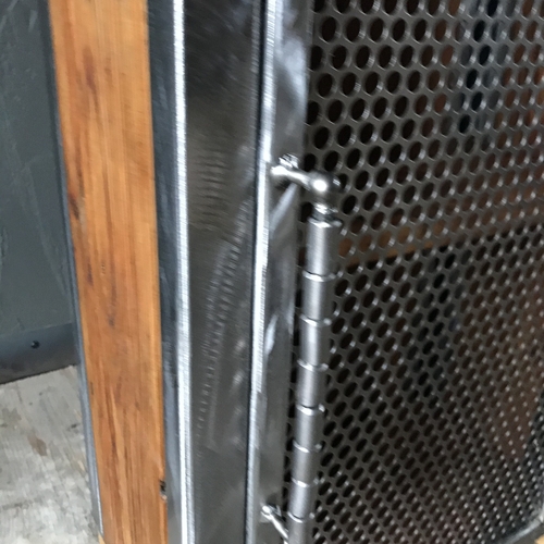 Small industrial cupboard with perforated mesh door