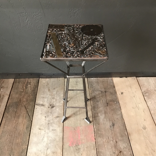Handcrafted ‘bits and pieces’ metal table