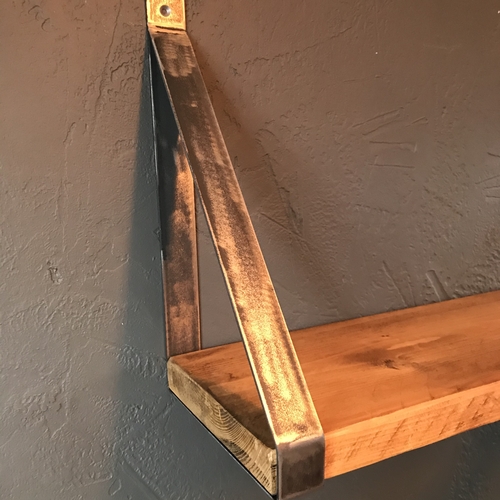 Rustic scaffold board shelf with handcrafted metal brackets