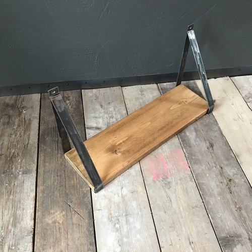 Rustic scaffold board shelf with handcrafted metal brackets