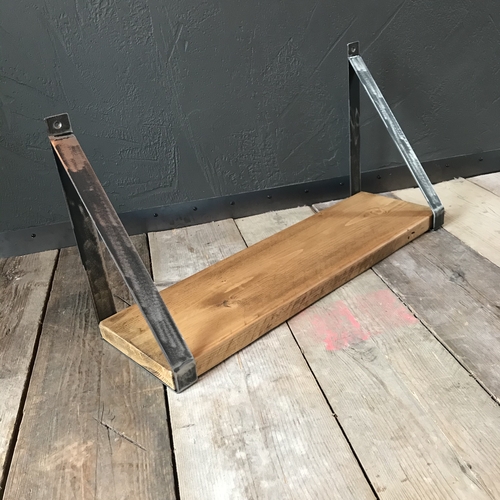 Rustic scaffold board shelf with handcrafted metal brackets