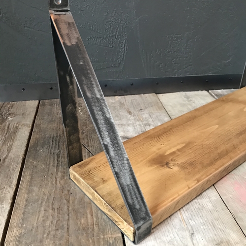 Rustic scaffold board shelf with handcrafted metal brackets