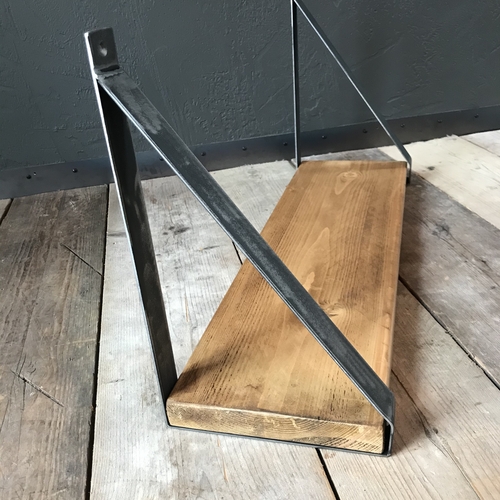 Rustic scaffold board shelf with handcrafted metal brackets
