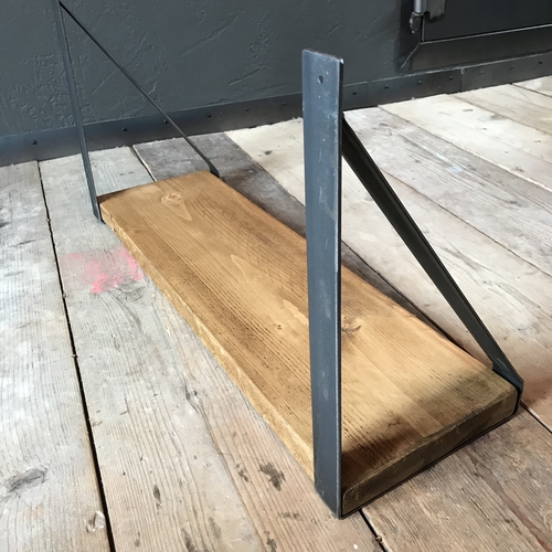 Rustic scaffold board shelf with handcrafted metal brackets