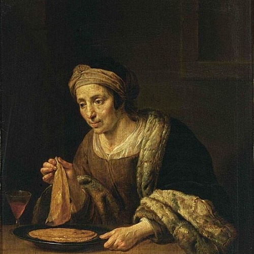 A Woman Holding Pancakes
