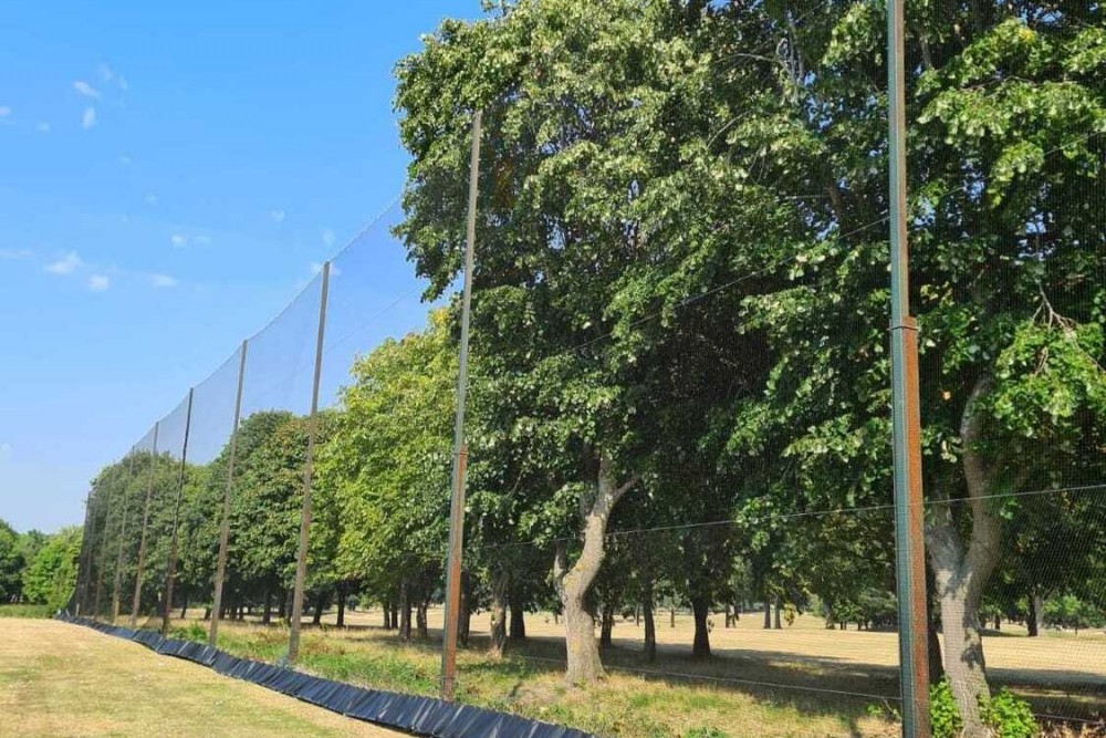 Golf range net anchoring