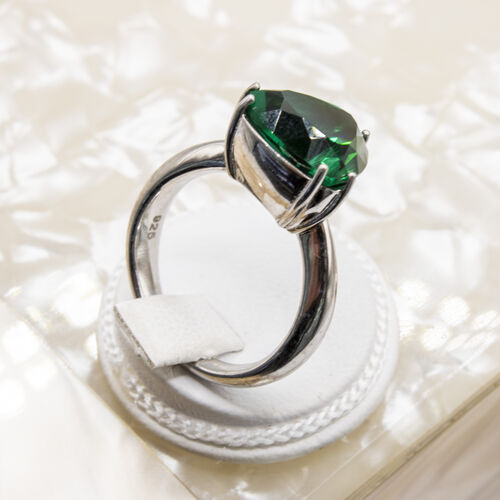 Trillion cut rhodium plated green natural gem stone set on 925 sterling silver