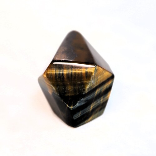 Tigers Eye Palm Stone Faceted sides.