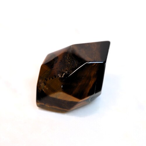 Tigers Eye Palm Stone Faceted sides.