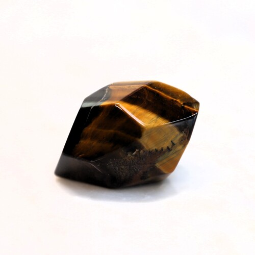 Tigers Eye Palm Stone Faceted sides.