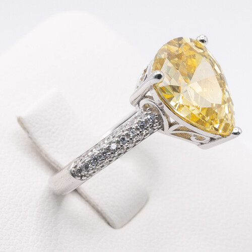 925 sterling silver ring set on yellow and clear moissanite stone
