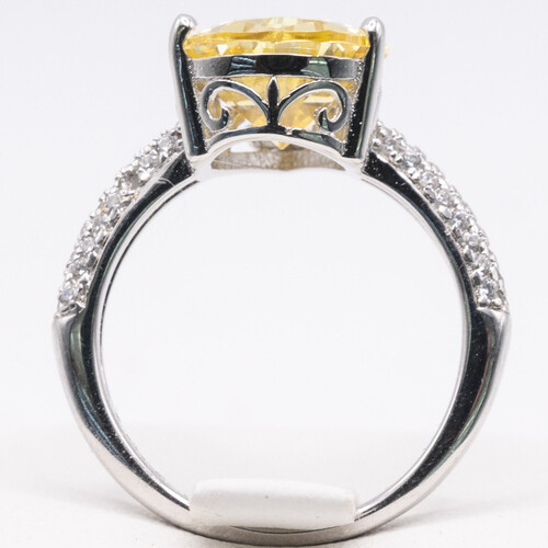 925 sterling silver ring set on yellow and clear moissanite stone
