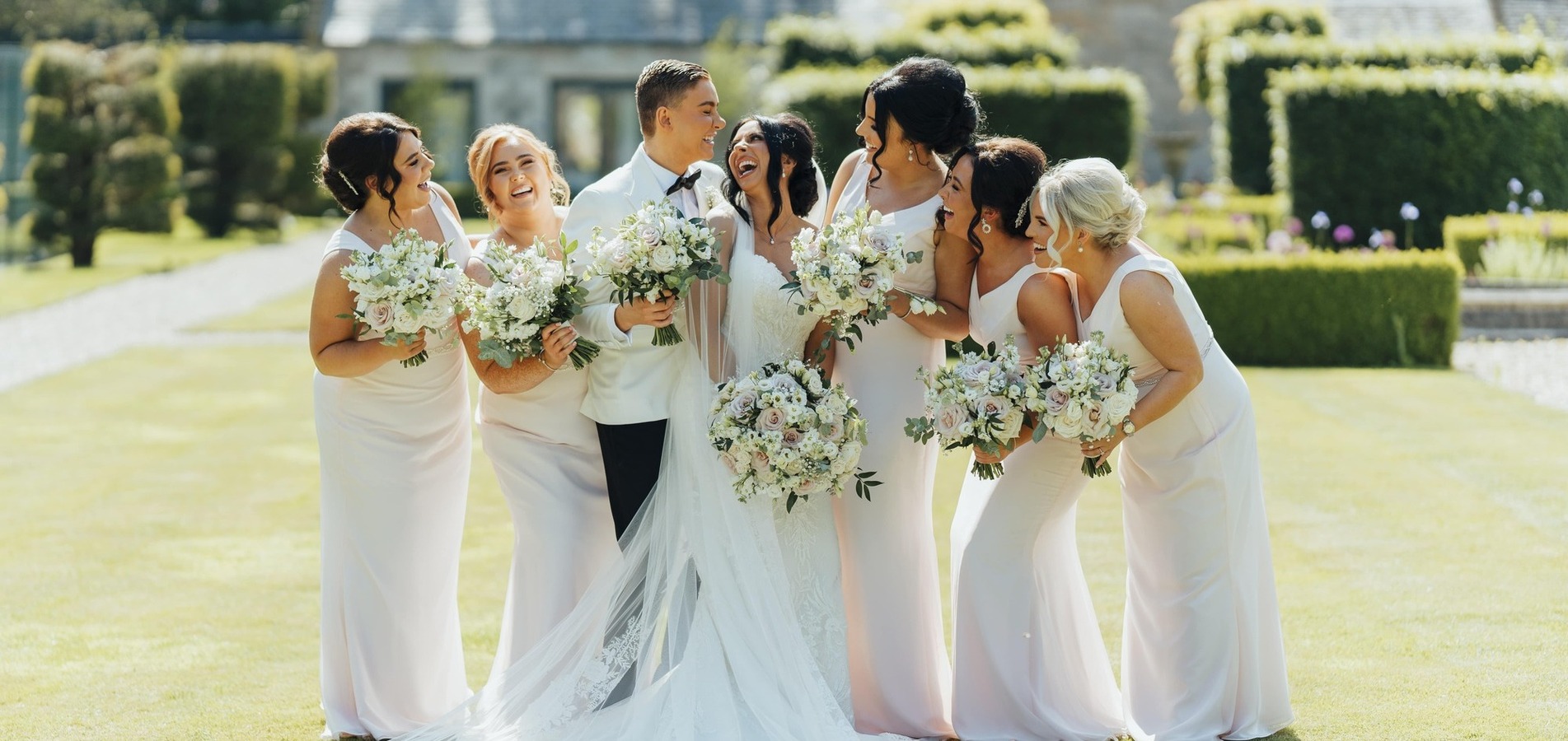 bride and bridesmaids flowers wedding party