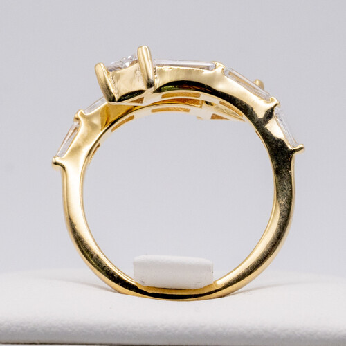 Baguette cut zirconia stones set vertically on yellow gold plated silver ring