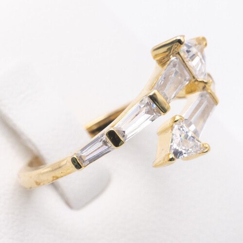 Baguette cut zirconia stones set vertically on yellow gold plated silver ring