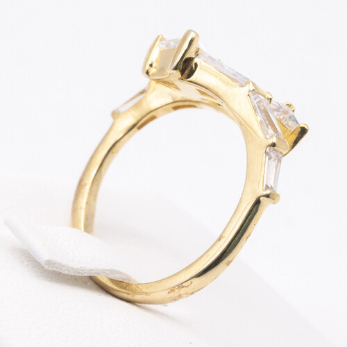 Baguette cut zirconia stones set vertically on yellow gold plated silver ring