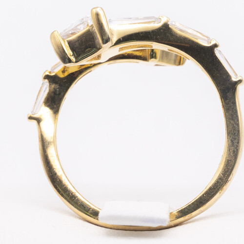 Baguette cut zirconia stones set vertically on yellow gold plated silver ring