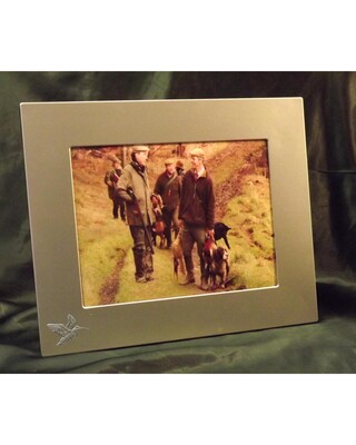 Large single image frame with small pewter Embellishment.