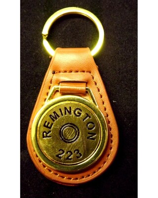 Gold plated representation of a head stamp on a leather key fob