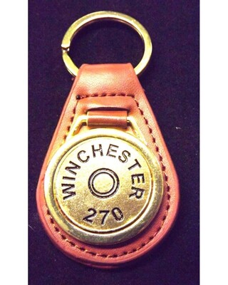 Gold plated representation of a head stamp on a leather key fob