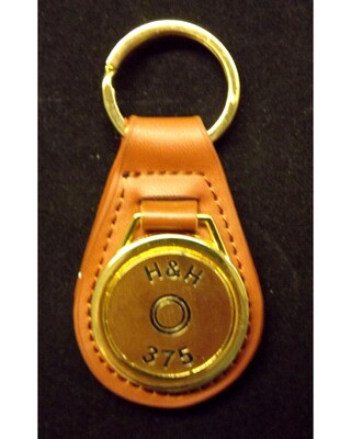 Gold plated representation of a head stamp on a leather key fob