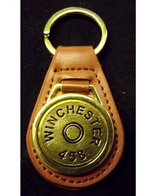 Gold plated representation of a head stamp on a leather key fob