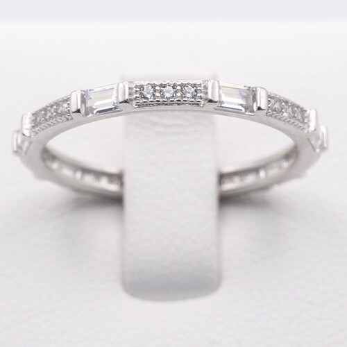 Full eternity ring featuring alternate baguette and round cut zirconia stones