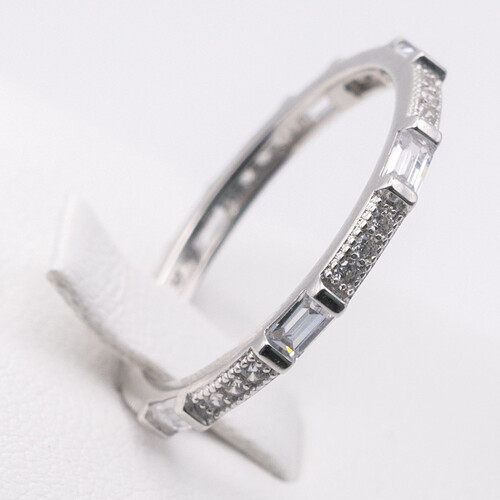 Full eternity ring featuring alternate baguette and round cut zirconia stones