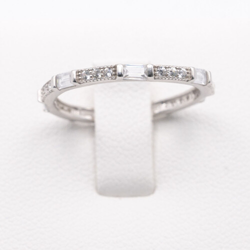 Full eternity ring featuring alternate baguette and round cut zirconia stones