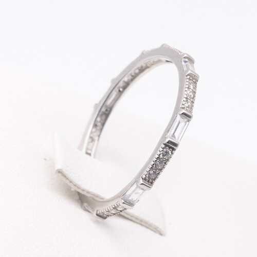Full eternity ring featuring alternate baguette and round cut zirconia stones