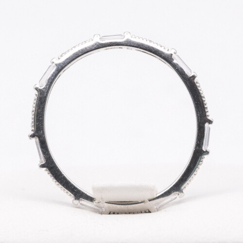 Full eternity ring featuring alternate baguette and round cut zirconia stones