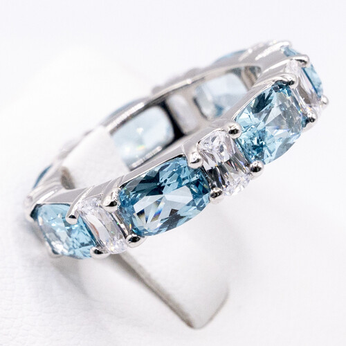 Multi paved alternate blue and clear moissanite stones set on 925 sterling silver ring