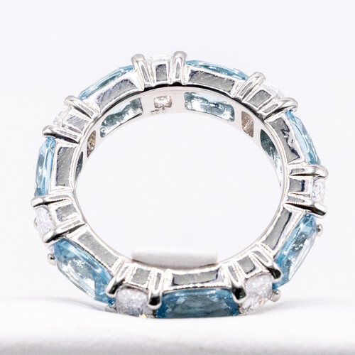 Multi paved alternate blue and clear moissanite stones set on 925 sterling silver ring
