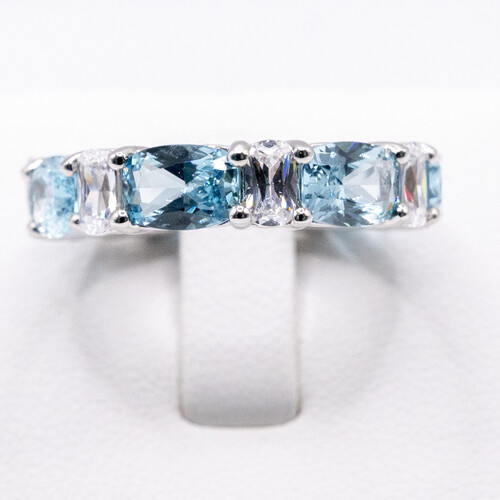 Multi paved alternate blue and clear moissanite stones set on 925 sterling silver ring