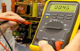 Engineer repairing an alarm system