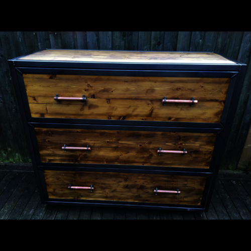 Industrial chest of drawers with copper handles and metal detail