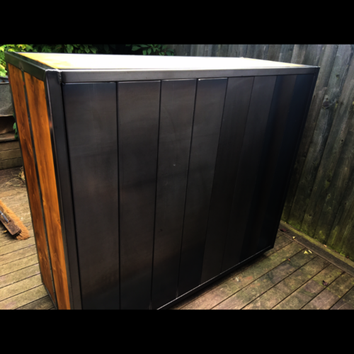 Industrial chest of drawers with copper handles and metal detail