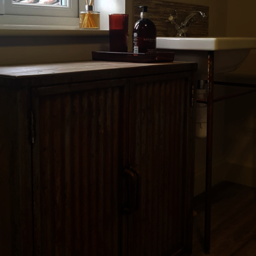 Bespoke bathroom cupboard with rusty doors