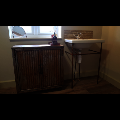 Rusty metal basin stand