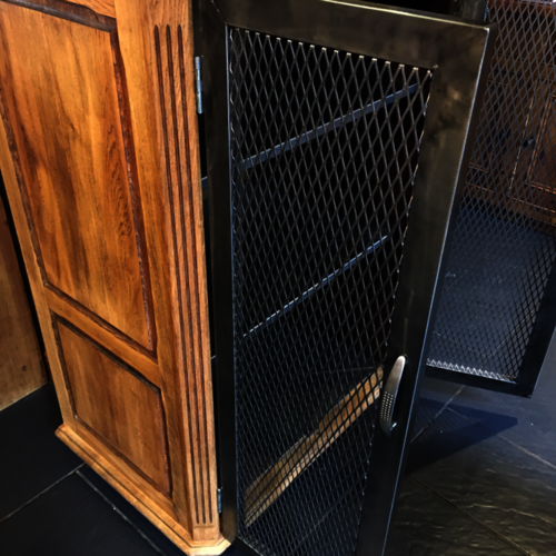 Upcycled oak cupboard with metal mesh doors
