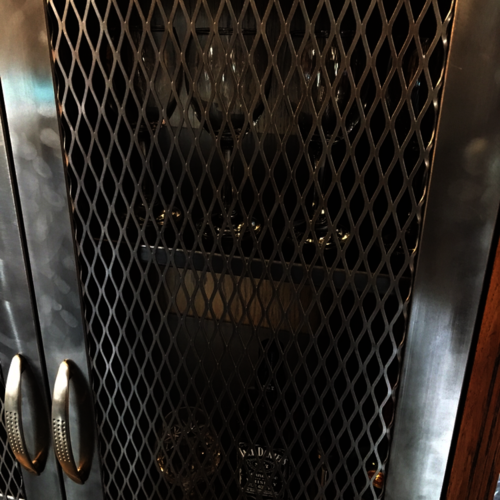 Upcycled oak cupboard with metal mesh doors