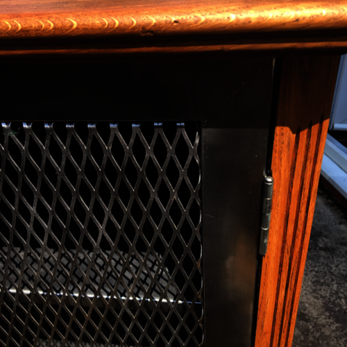 Upcycled oak cupboard with metal mesh doors