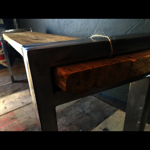 Rustic reclaimed scaffold bench with shiny metal legs