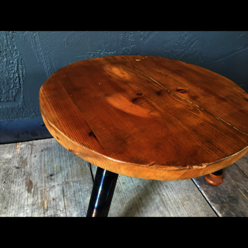 Small footstool with colourful metal legs