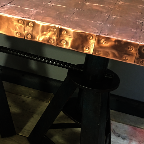 Copper top coffee table with upcycled old axle stand legs